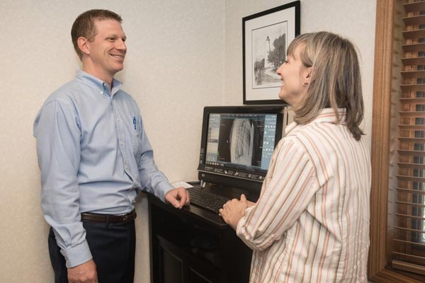Chiropractor Lake Geneva WI Christopher Kaiser Talking to Patient Chiropractor Lake Geneva WI Christopher Kaiser Talking to Patient